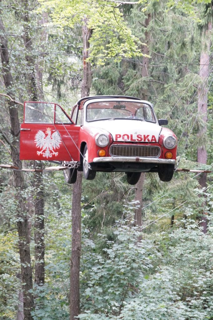 Old car suspended in the air